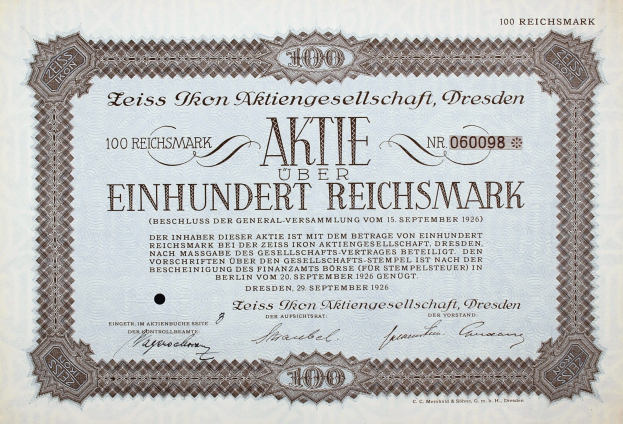 Altes deutsches Aktienzertifikat für 100 Reichsmark mit schwarzem Rand und deutscher Beschriftung.