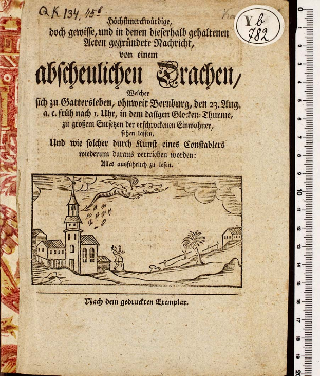 Ein aufgeschlagenes Buch mit dem Titel "Abbeulichten Bragen" und einer Zeichnung einer Kirche, Text und einem Lineal.