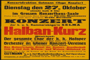 Ein gelber Plakatständer mit der Aufschrift 'Konzert Halban-Kurz' wirbt für ein Konzert in Berlin, Deutschland.