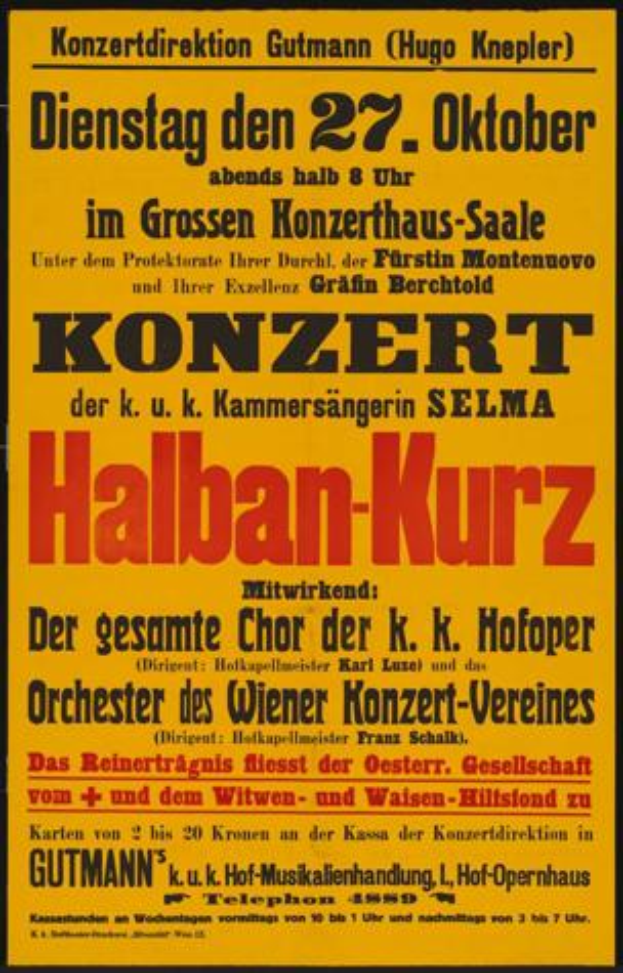 Ein gelber Plakatständer mit der Aufschrift 'Konzert Halban-Kurz' wirbt für ein Konzert in Berlin, Deutschland.