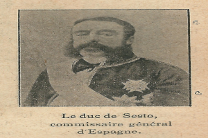 Ein altes Foto eines bärtigen Mannes in Anzug und Krawatte mit ernstem Gesichtsausdruck, der in die Ferne schaut.