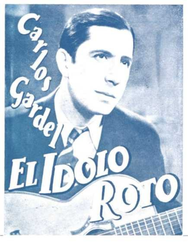 Plakat des spanischen Singer-Songwriters El Idolo Roro, der eine Gitarre hält und ein weißes Hemd und einen schwarzen Anzug trägt, mit hellblauem Hintergrund und fetter schwarzer Schrift.